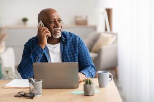 man struggling to hear phone call due to hearing loss.
